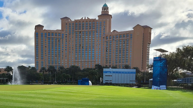 golf course with building in background at the Ritz Carlton Orlando Grande Lakes