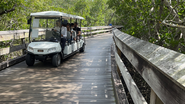Tram shuttles visitors to the beach at Clam Pass Park