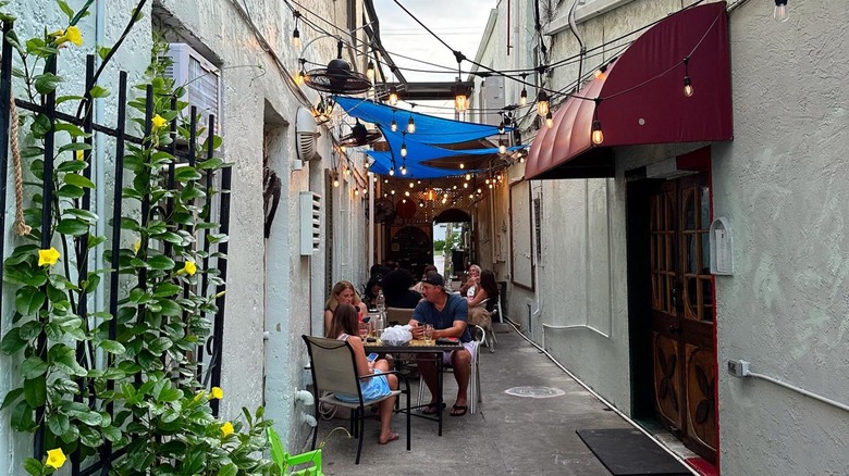 The narrow walkway dining area at Oggi Italian