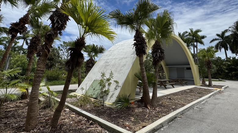 An abandoned zoo enclosure with picnic tables at the Crandon Garden in Miami
