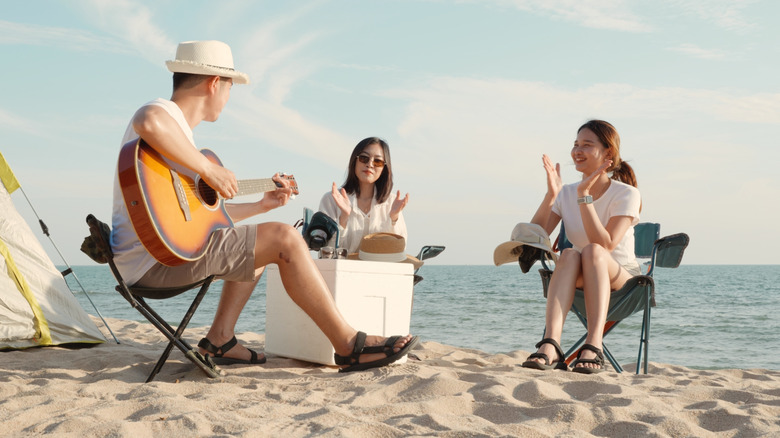 Friends camping by the beach