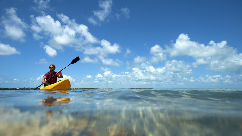 Man on a kayak paddles along Florida's Gulf