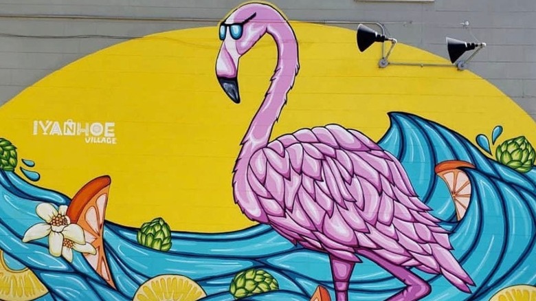 mural of pink flamingo wearing sunglasses