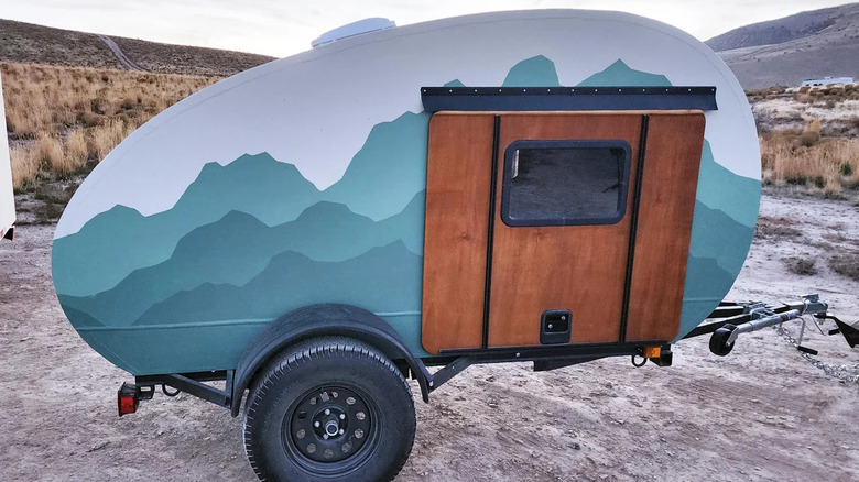 Foamie teardrop trailer with a green mountain design