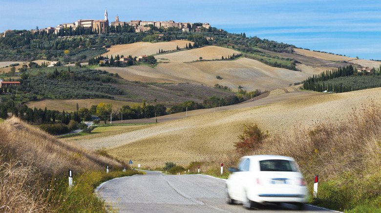 Car driving to Italian hill town
