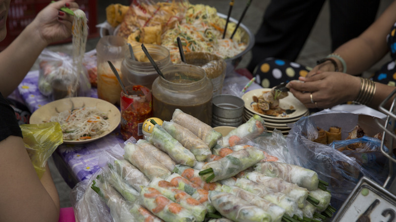 A street vendor in Ho Chi Minh selling spring rolls and other Vietnamese foods