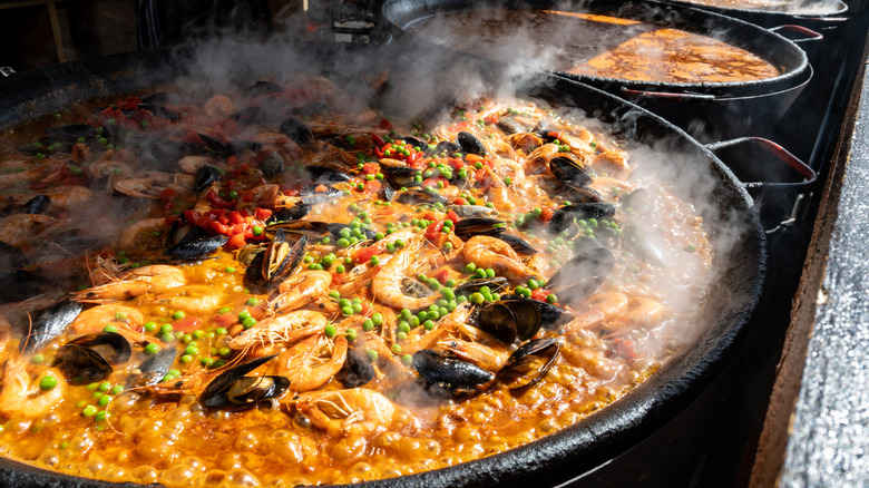 paella cooking in large pan in london