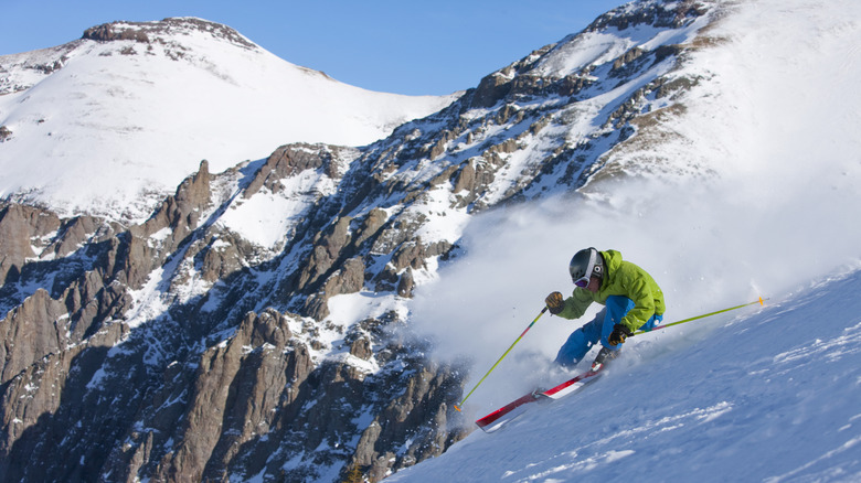 A skier rushes down a snowy slope in Telluride, Colorado