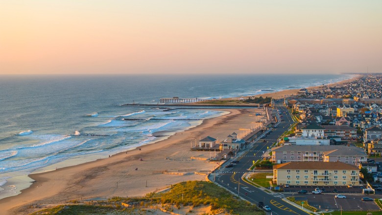 Aerial shot of the golden sand shoreline of Belmar, New Jersey at sunrise.