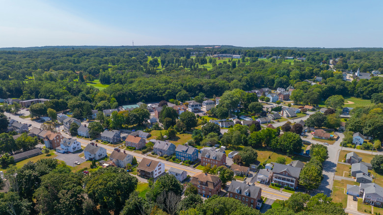 An aerial view of a street in Lincoln, Rhode Island on a clear, bright day