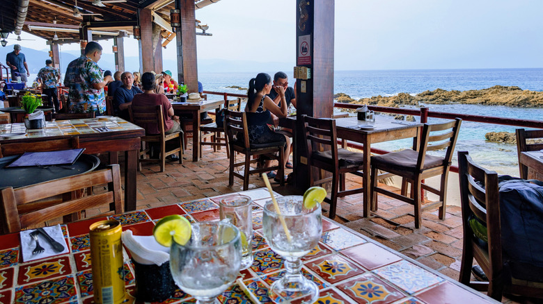 The oceanfront patio at La Playita Restaurant in Conchas Chinas Mexico