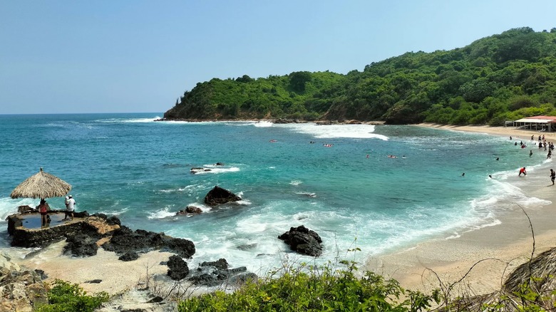 People swimming at Playa Coral on Isla Ixtapa, Mexico