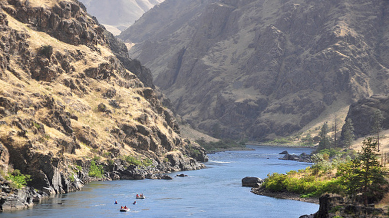 Rafts and kayaks descend the Snake River in Hells Canyon on the border between Idaho and Oregon