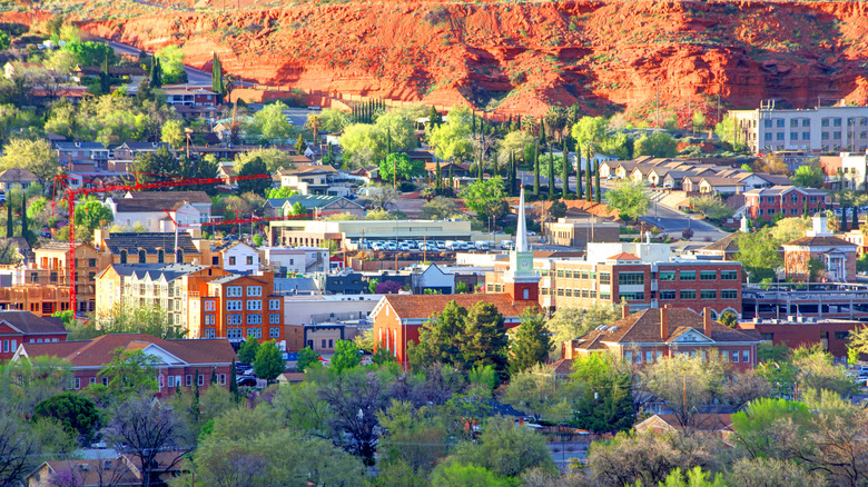 Aerial view of St. George, Utah, with trees, buildings, and a canyon edge
