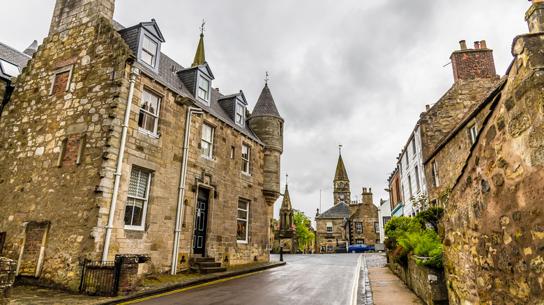 A street with historic buildings leading to the main square in Falkland, Scotland