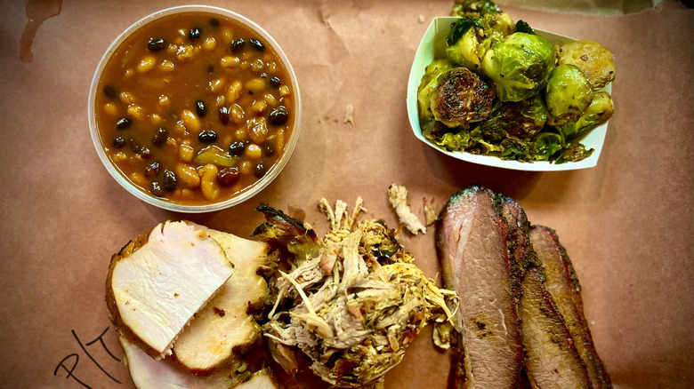 A delicious looking sampling of barbecued meats and sides