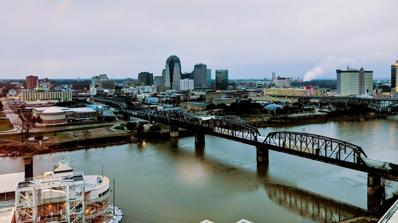 Bossier City's riverfront, bridge, and high-rises on a cloudy day.