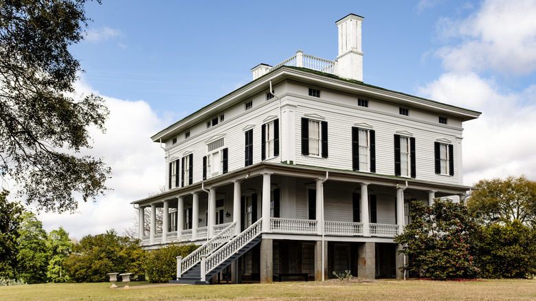 Redcliffe Plantation State Historic Site exterior, with trees surrounding a white house