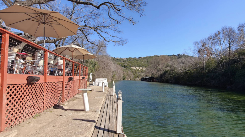 The exterior patio of County Line On the Lake along Austin Lake in West Lake Hills, RX on a clear, bright day