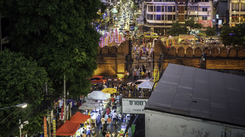 Aerial view of the Sunday Walking Street food market by the old city walls of Chiang Mai