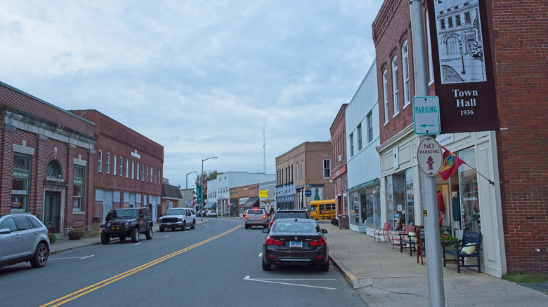 Town of Onancock, with cars driving down a road lined in brick buildings