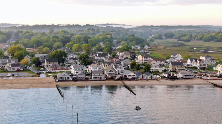 Waterfront houses with green rolling hills and fog in Middlesex County, Connecticut