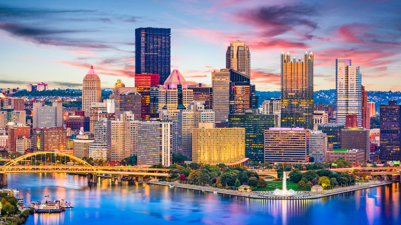 Skyline view of high-rises and bridges along the Pittsburgh waterfront at sunset in Pennsylvania.