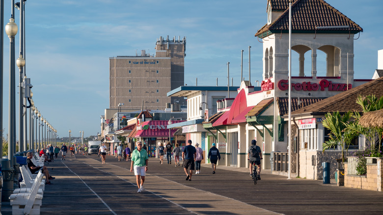 Hotels, shops, and people along the Rehoboth Boardwalk in Rehoboth Beach, Delaware