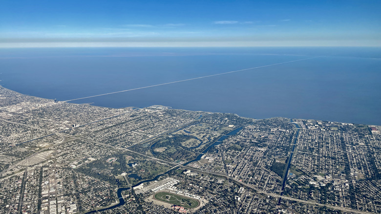 Aerial view of a lakeside suburb, with long bridge crossing the waters, Metairie and Lake Pontchartrain