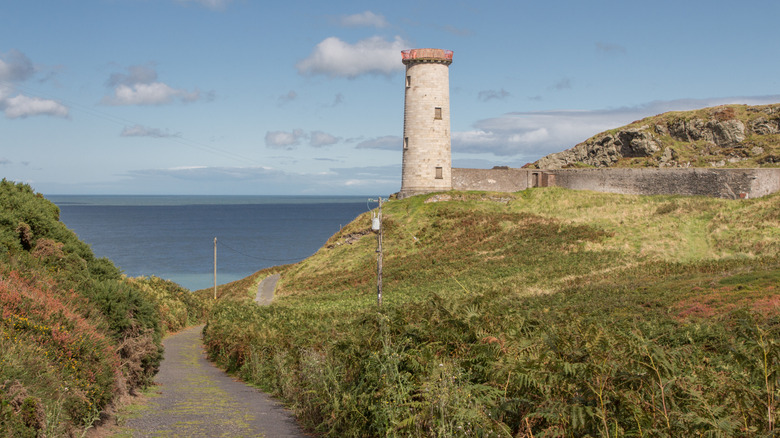 An old lighthouse stands on the Wexford coast of eastern Ireland