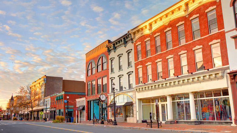 Red Bank's downtown main street with three story red brick buildings and iconic lampposts and clock posts.