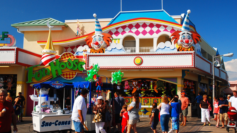 People enjoy a sunny summer day on the boardwalk in Point Pleasant, New Jersey