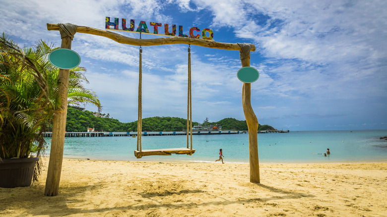 A swing on one of Huatulco, Mexico's beautiful white sand beaches
