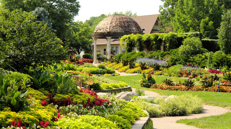 The Sunken Gardens in Lincoln, Nebraska, with grass, trees, flowers, shrubs, and a gazebo
