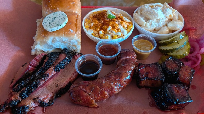 A delicious looking sampling of barbecued meats and sides
