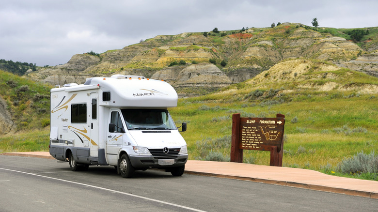 An RV drives through a park in North Dakota