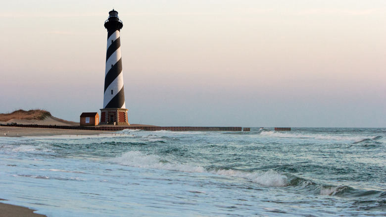 A picturesque lighthouse on the beach at North Carolina's Cape Hatteras