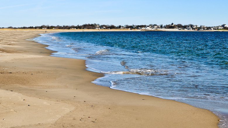 Views of the Atlantic seashore and coastal mansions from Watch Hill Beach in the Napatree Point Conservation Area in Westerly, Rhode Island