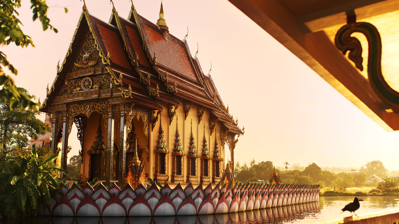 A Buddhist temple on Koh Samui at sunset golden hour