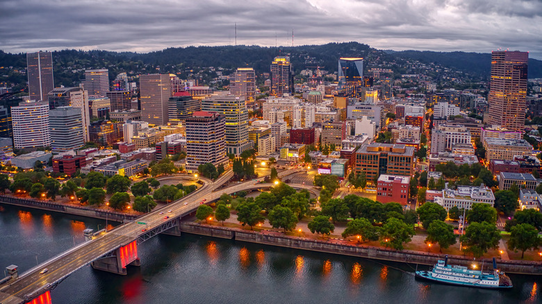 The buildings of Portland, Oregon, rise over a river