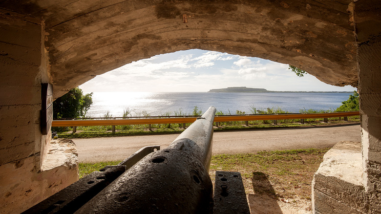 An old Japanese cannon is trained on a distant point on the island of Rota, Northern Mariana Islands