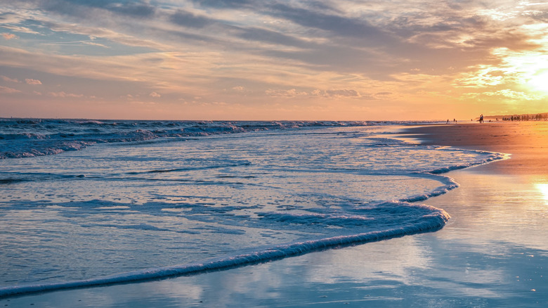People enjoying sunset at the coastline of Hilton Head Island, South Carolina, USA