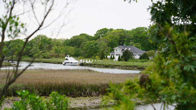 Waterfront in Mattituck with speedboat parked outside