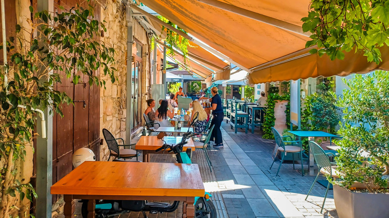 Sidewalk cafes line the streets of old town in Limassol, Cyprus