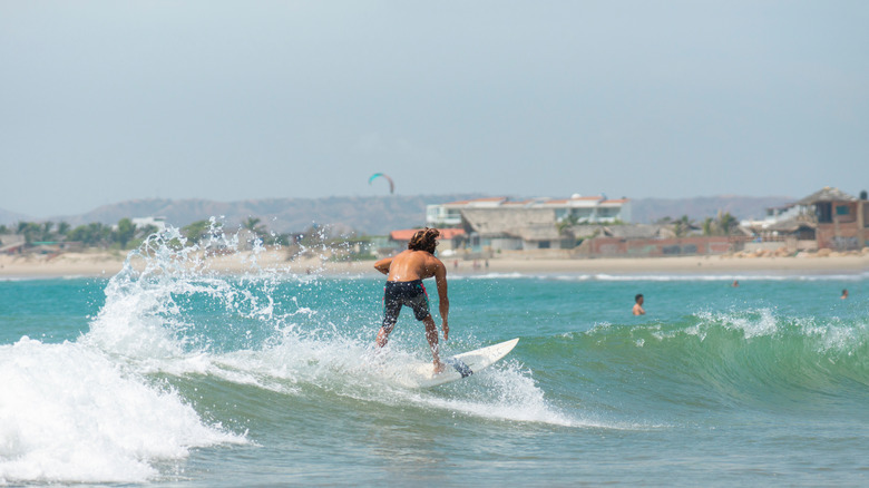 Man surfing at Máncora, Peru