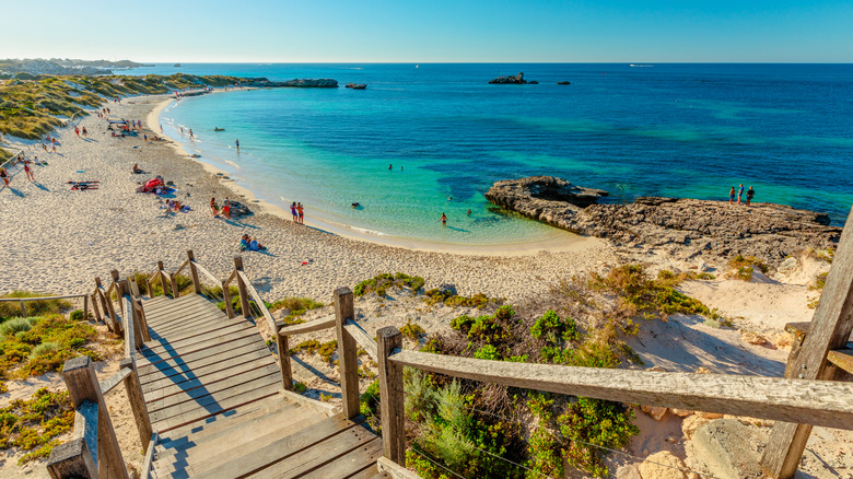 Exceptional turquoise bay of Pinky Beach at Rottnest Island with tourists swimming