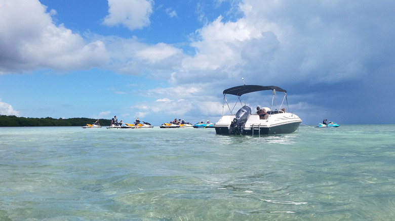 A boat and jet skis in the ocean at Boca Chica Key Florida