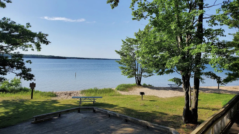 picnic tables set at Otsego Lake State Park in Michigan