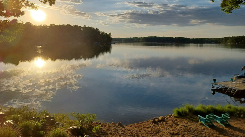 A view of the water from the shoreline during sunset on Spider Lake