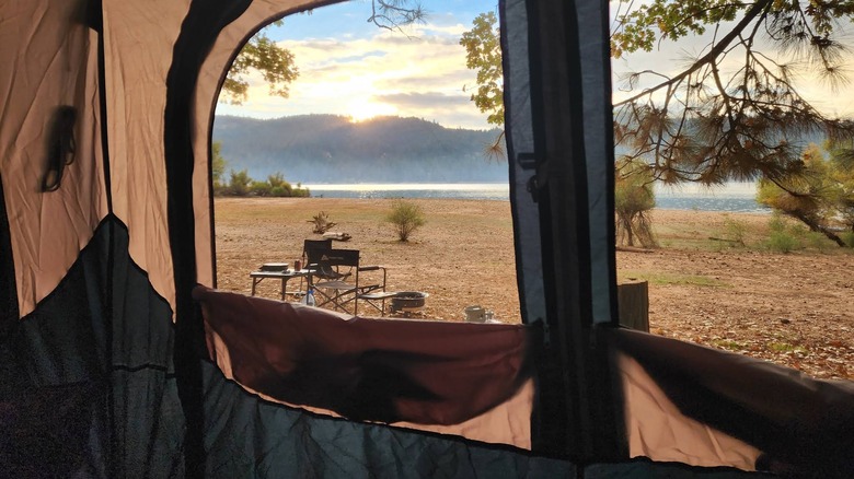 A view of the campground at Scotts Flat Lake peering through tent windows
